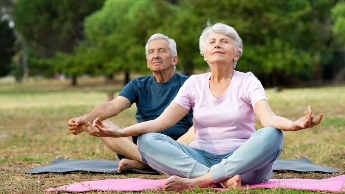 Senior couple doing yoga