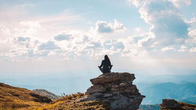 Woman doing yoga in nature.