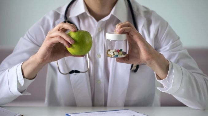 Doctor explaining vitamins benefits