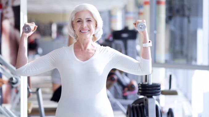 Happy senior woman exercising