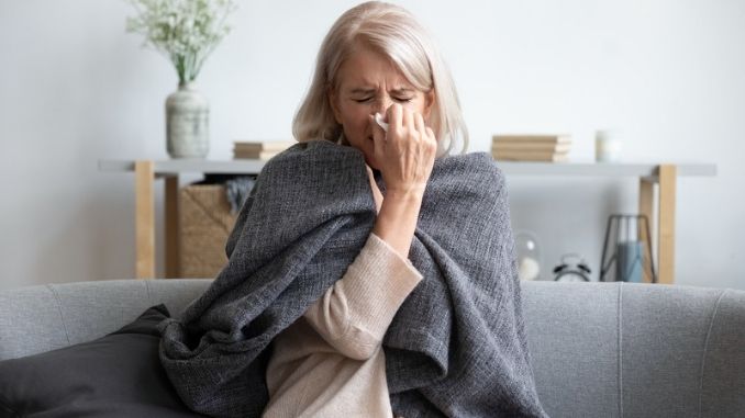 woman sneezing Immune Support Supplement