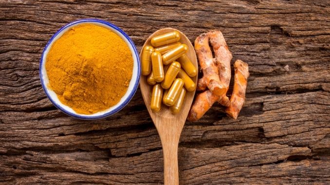 roots curcumin on wooden plate