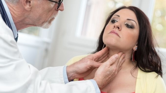 doctor-checking-thyroid