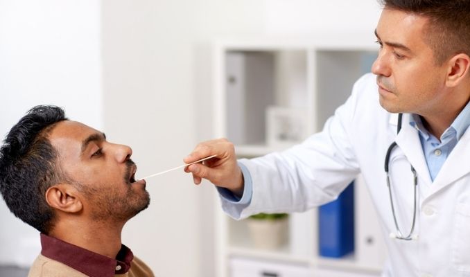 examining patient throat