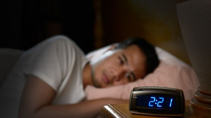 Insomnia Prevention Tips: man-insomnia-lying-bed