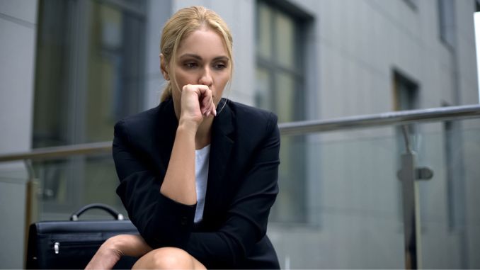 woman-sitting-bench-worried