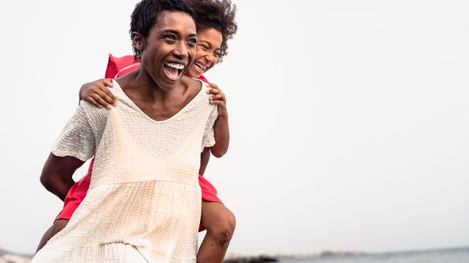 happy-african-family-beach-summer